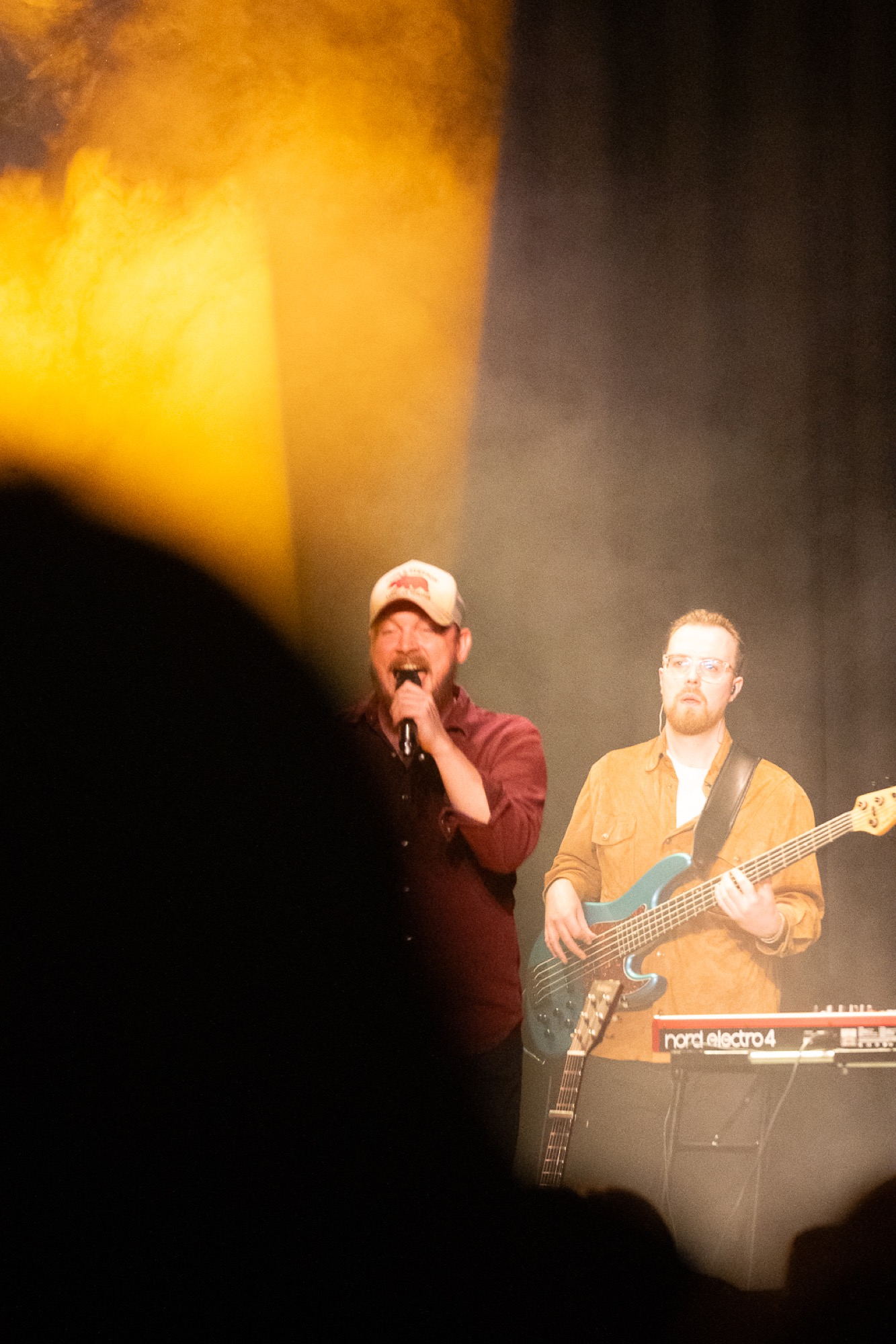 Your Country Band lead vocalist and bassist on stage